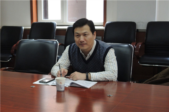 市教工委王建辉副处长指导工作.jpg